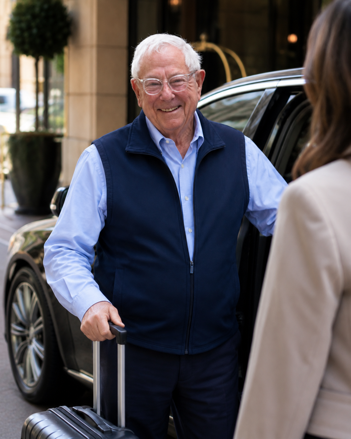 Louis Van Leeuwen with luggage at hotel entrance